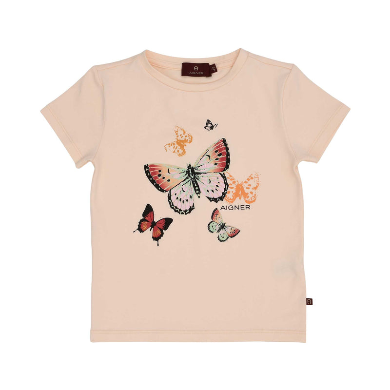 Front view of a peach-colored AIGNER Kids t-shirt featuring a colorful butterfly graphic and the brand logo.
