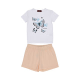 Front view of AIGNER Kids outfit: White t-shirt with blue and black butterfly prints and "AIGNER" logo, paired with peach-colored elasticated shorts.