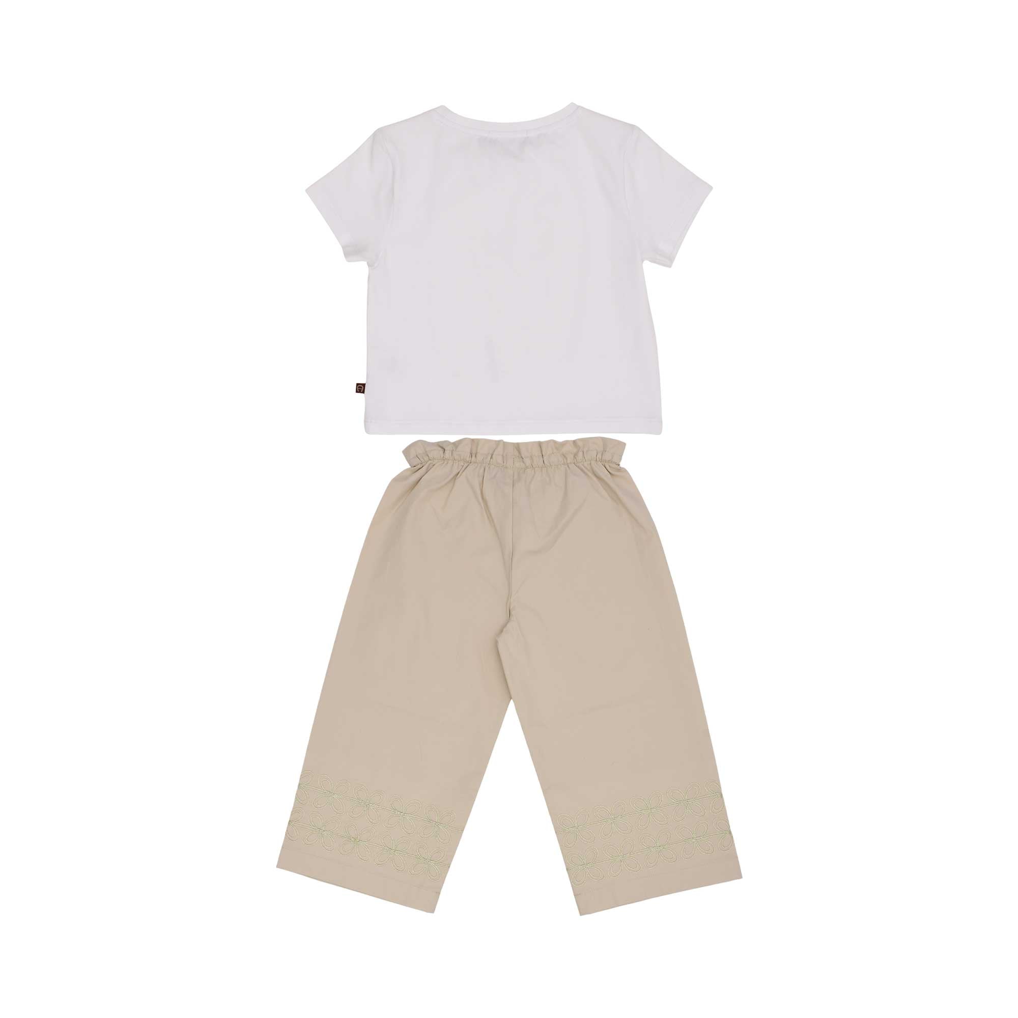 The back view of the AIGNER Kids set, showing the plain white t-shirt and the comfortable elasticated waistband of the beige wide-leg trousers.