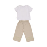 The back view of the AIGNER Kids set, showing the plain white t-shirt and the comfortable elasticated waistband of the beige wide-leg trousers.