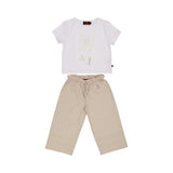 A girls' outfit featuring a white t-shirt with a sage green floral graphic and a pair of beige wide-leg trousers with embroidered floral details at the bottom.