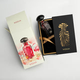 Widian Yasat luxury fragrance packaging display including the red perfume bottle nestled in a gold-rimmed black presentation box with a palm-leaf cutout slider, alongside an outer carton decorated with a watercolor flamingo illustration, from blue salon.
