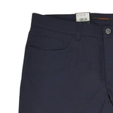 Navy blue textured pants with a curved front pocket, a small coin pocket, and a silver-toned button closure.