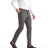 Dark grey slim-fit pants with a subtle micro-check pattern, front pockets with silver-toned rivets, button and zip fly, and b