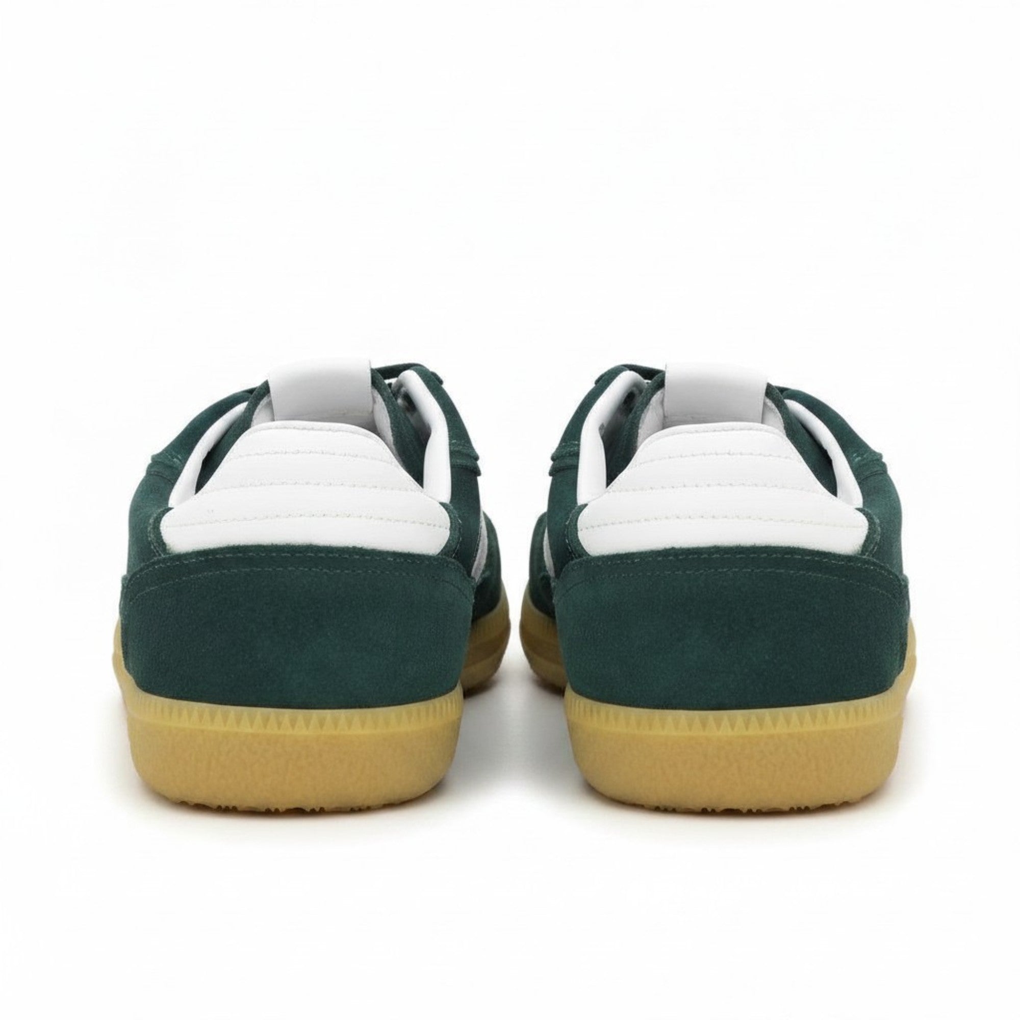 Rear heel view of a pair of ALOHAS sneakers showcasing the textured white leather heel tabs and the gum rubber sole border.