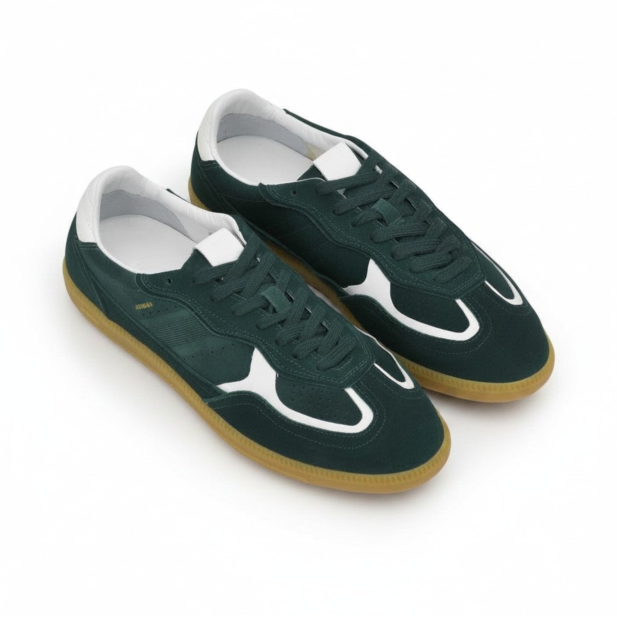 Oblique overhead view of a pair of ALOHAS forest green suede sneakers displaying their sleek retro silhouette and white lining.