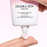 White and pink gradient tube of Lancome Hydra Zen Cream, dispensing light pink gel cream from its white nozzle.