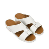 An overhead three-quarter angle view of a pair of Antonio white grained leather Arabic sandals, showcasing their rich texture and structured heritage design against a white background.