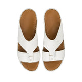 Direct top-down view of a pair of Antonio sandals showing the smooth white leather insoles cleanly debossed with the Antonio brand name and 'Hand Made in Italy' script against a white background.