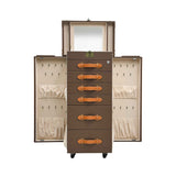 Angled view of the Artisan standing vanity trunk showing the depth of the drawers and the velvet-lined interior compartments.