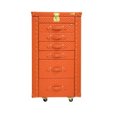 Front view of an Artisan orange trunk-style jewelry armoire, six drawers with handles, and a lockable top.