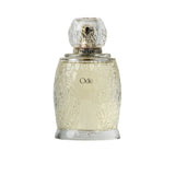 Artist’O Ode Eau de Parfum in an ornate clear glass bottle with a soft ivory fragrance, displayed with pastel pink luxury packaging – Find Online Today