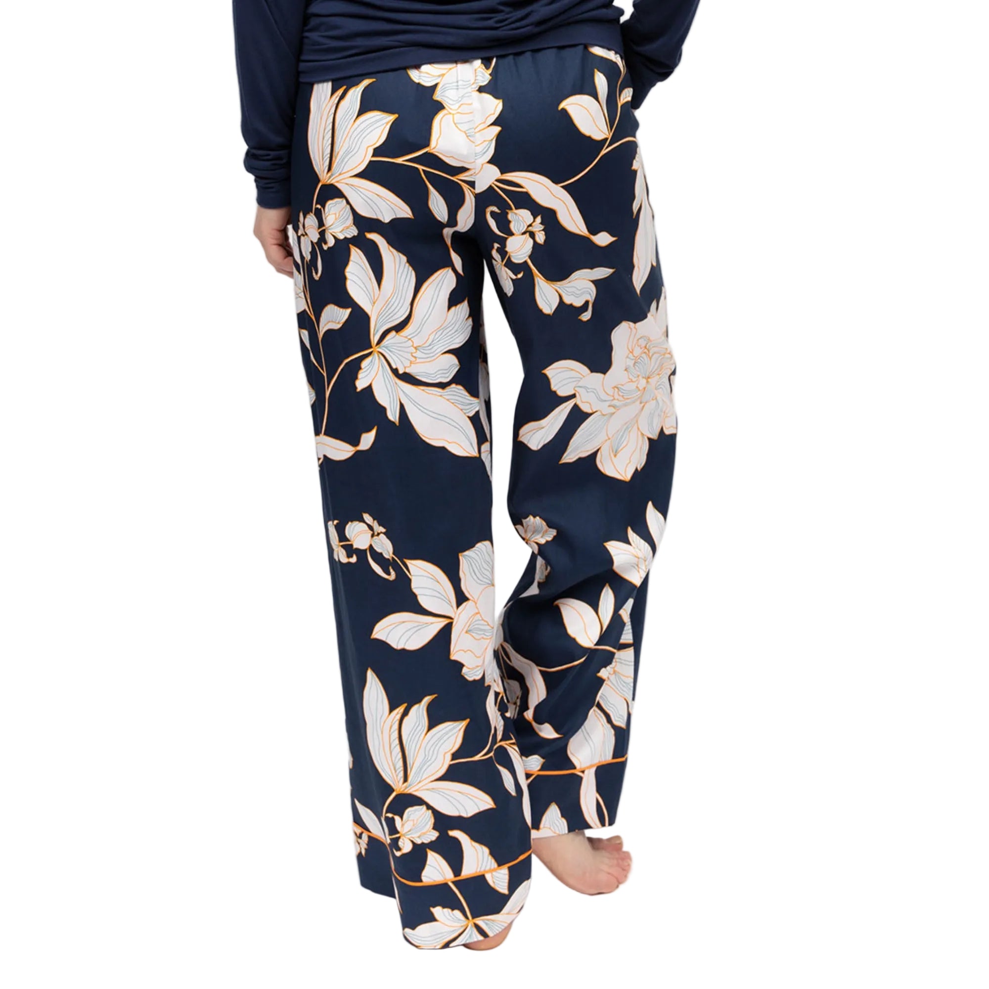 Navy wide-leg pyjama bottoms with a floral print featuring white flowers outlined in auburn/orange.