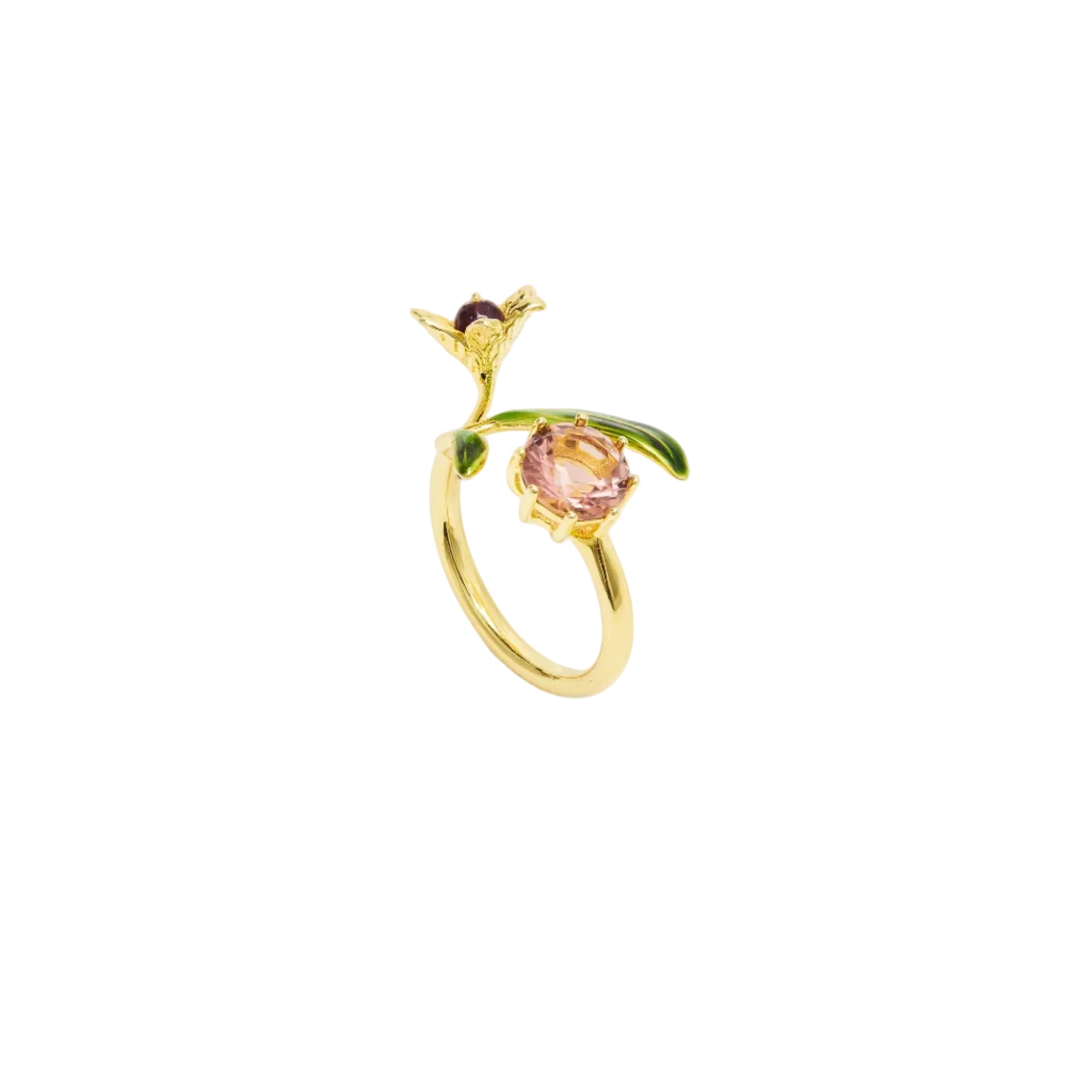 Gold-toned adjustable ring with green enamelled leaves, a pink faceted central stone, and a small dark red accent stone.