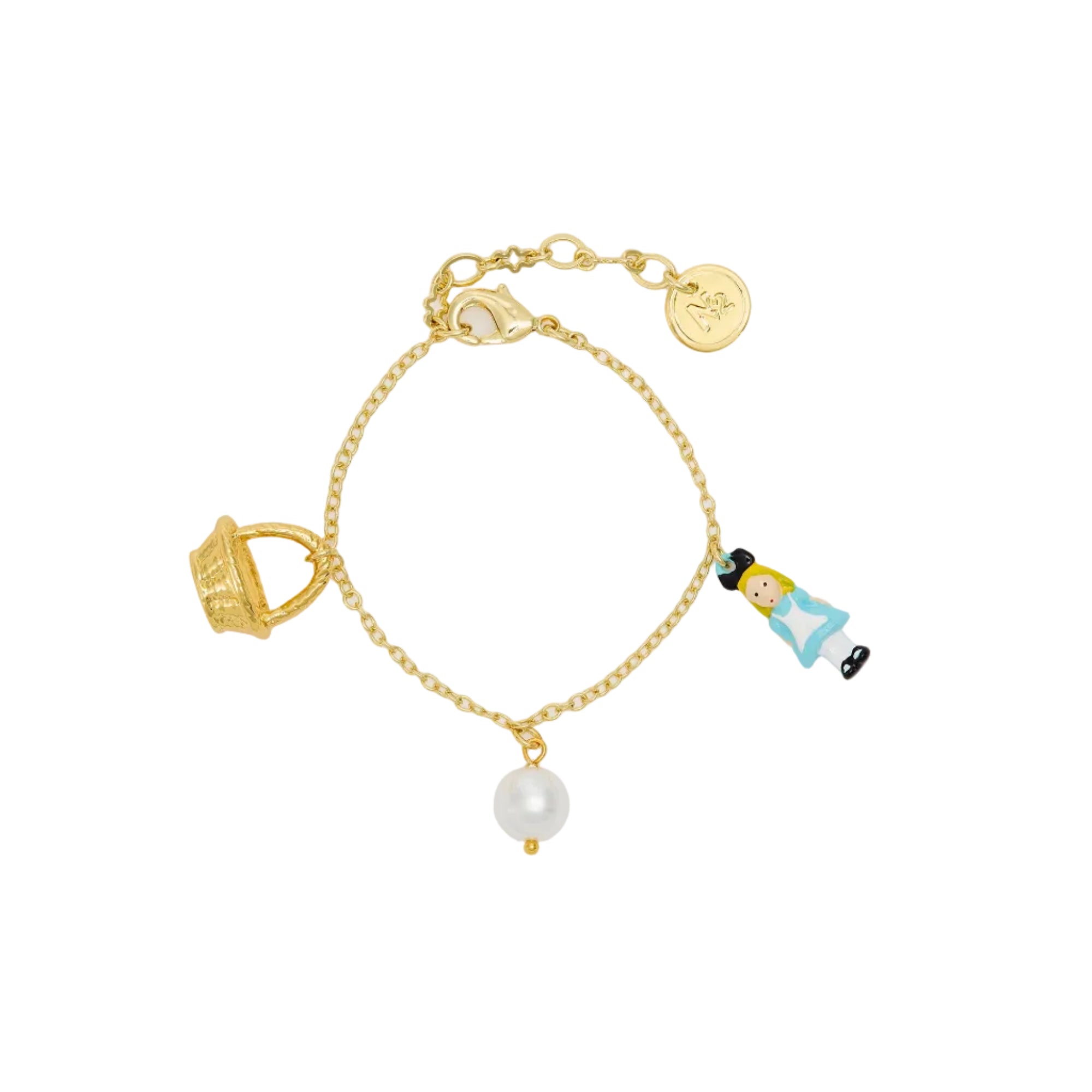 Gold-toned chain bracelet with a textured basket charm, a white imitation pearl, and a small figure charm in light blue and b