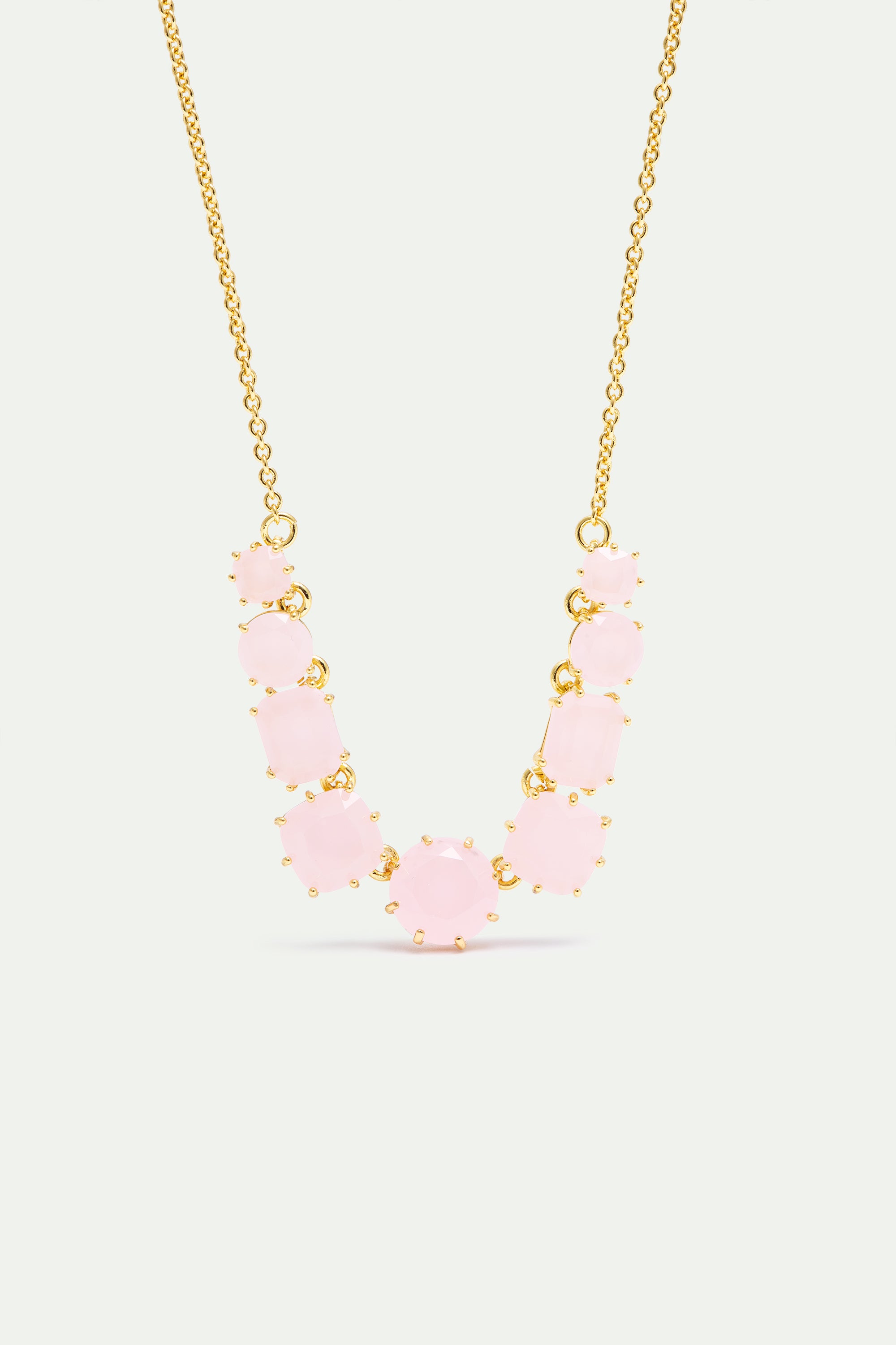 Rose pale faceted stone necklace with a delicate gold-toned chain and claw settings, featuring round and cushion-cut stones.