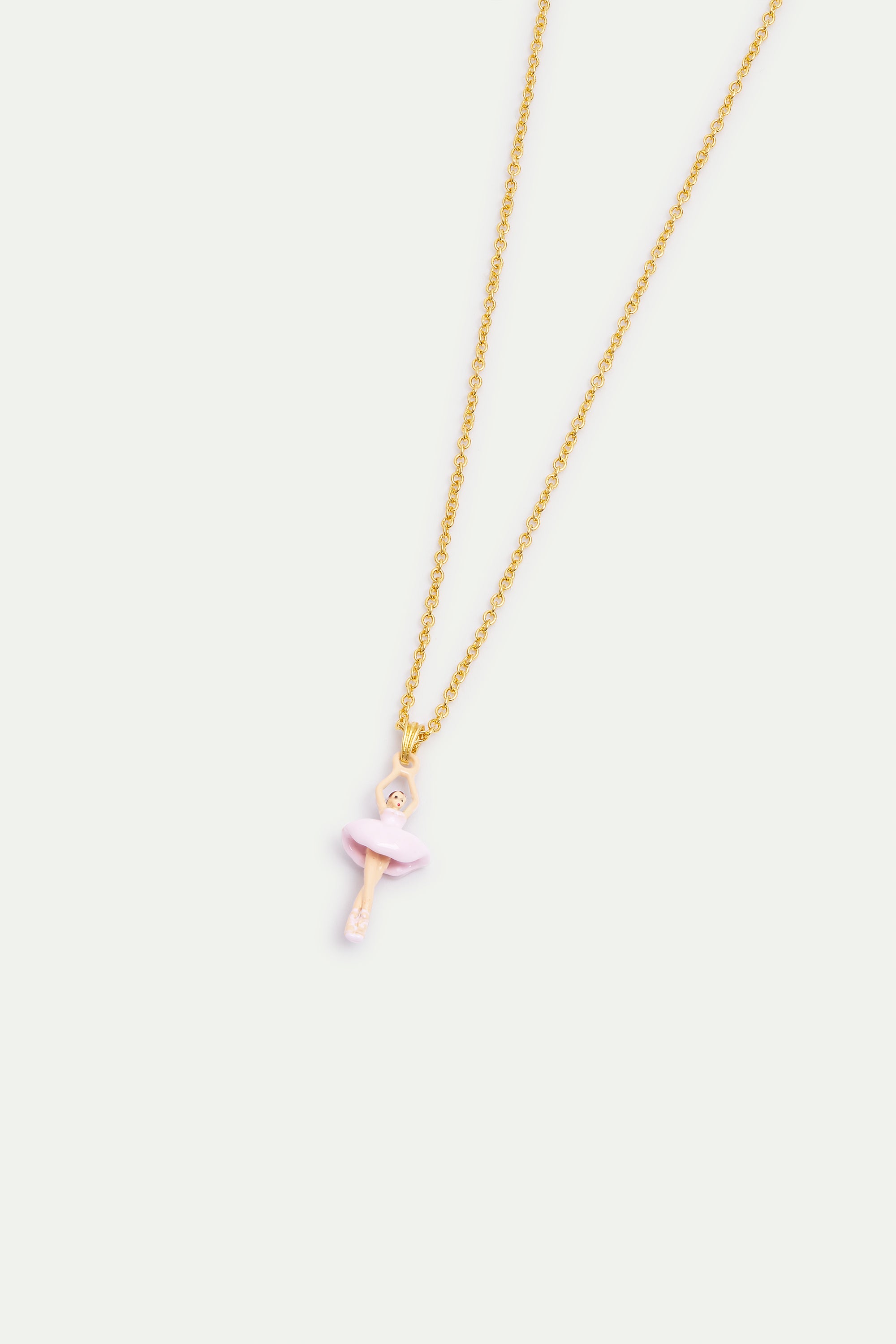 Gold-toned necklace with a light pink ballerina pendant wearing a tutu, arms raised.