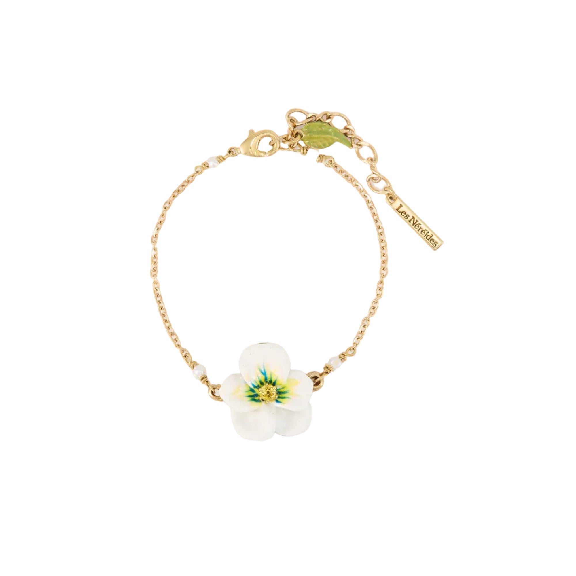 Gold-toned chain bracelet with a white and green enamel flower charm, small white beads, and a lobster clasp.