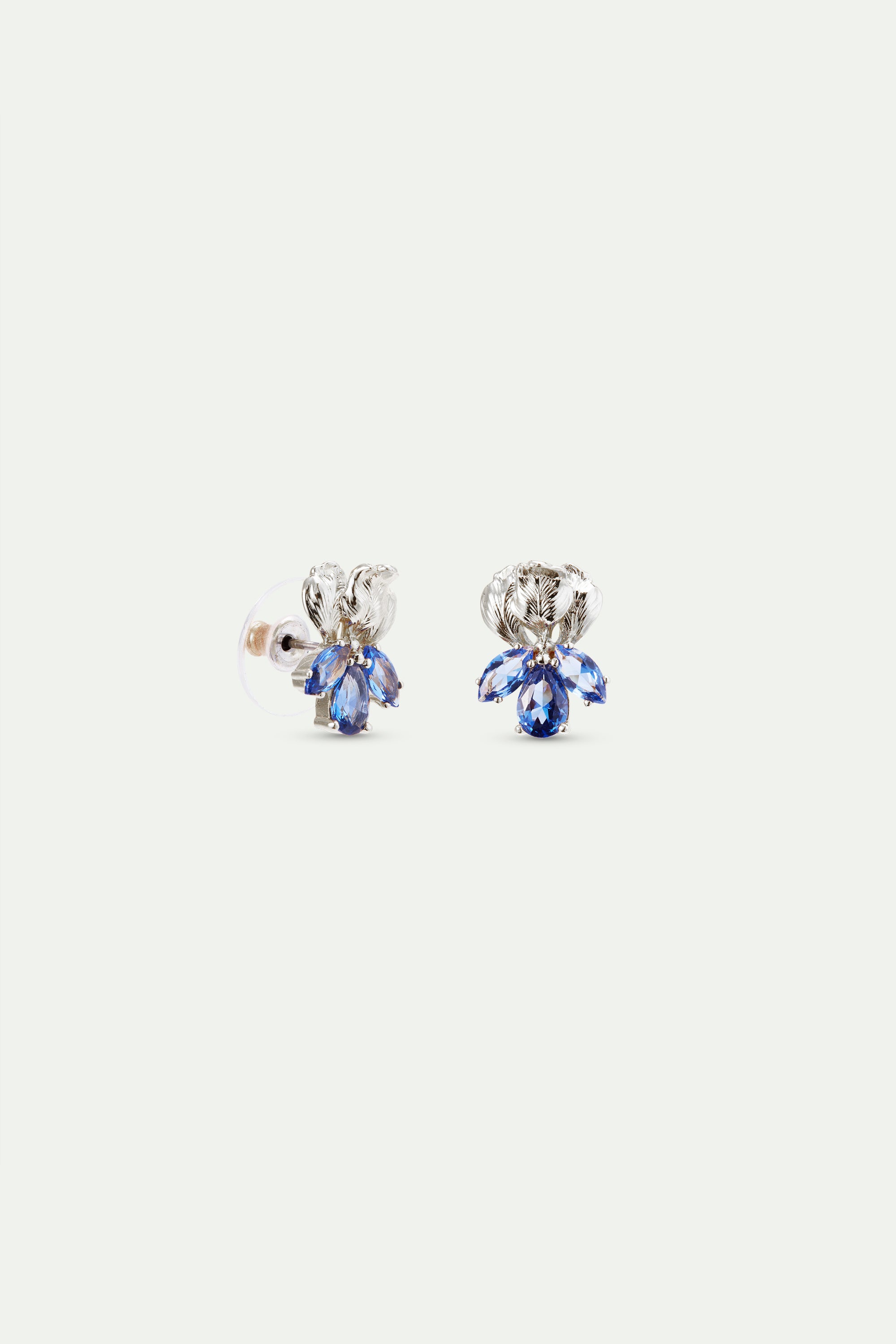 Pair of silver-toned post earrings, each with an engraved leaf design above three faceted blue teardrop stones.
