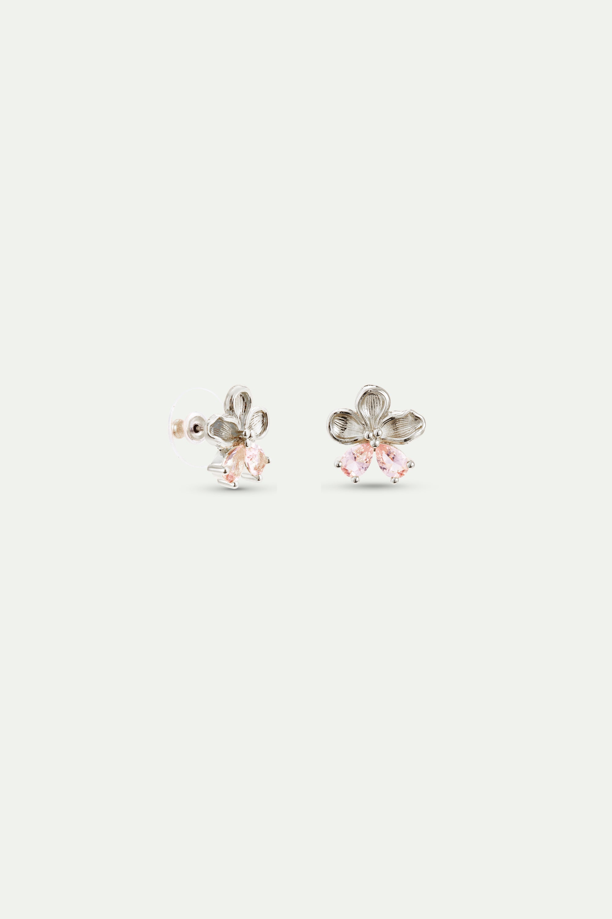 Pair of silver-toned flower stud earrings, each with three textured petals and three light pink tear-drop stones below.