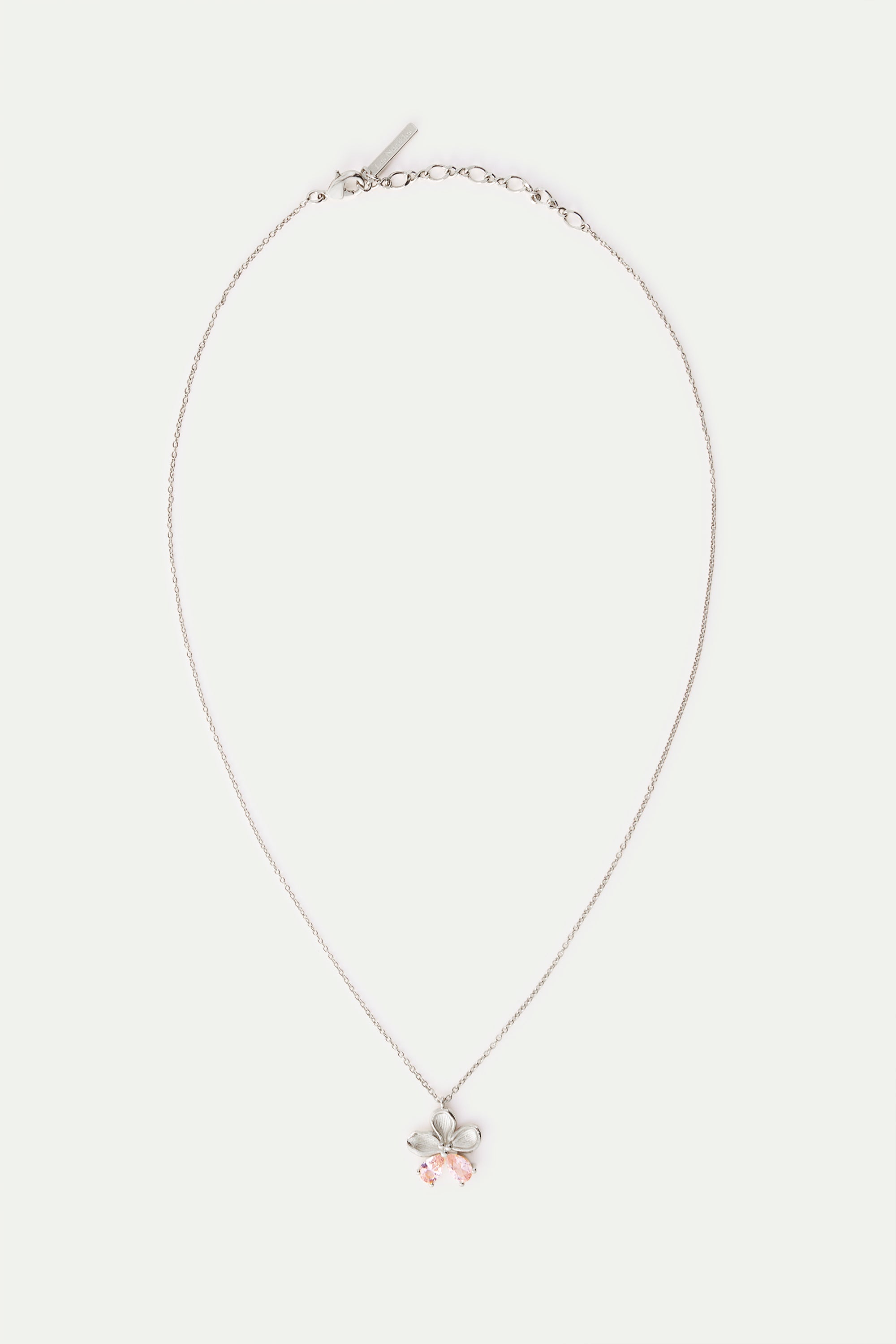 Silver-toned necklace with a flower pendant featuring five petals and two light pink teardrop stones.