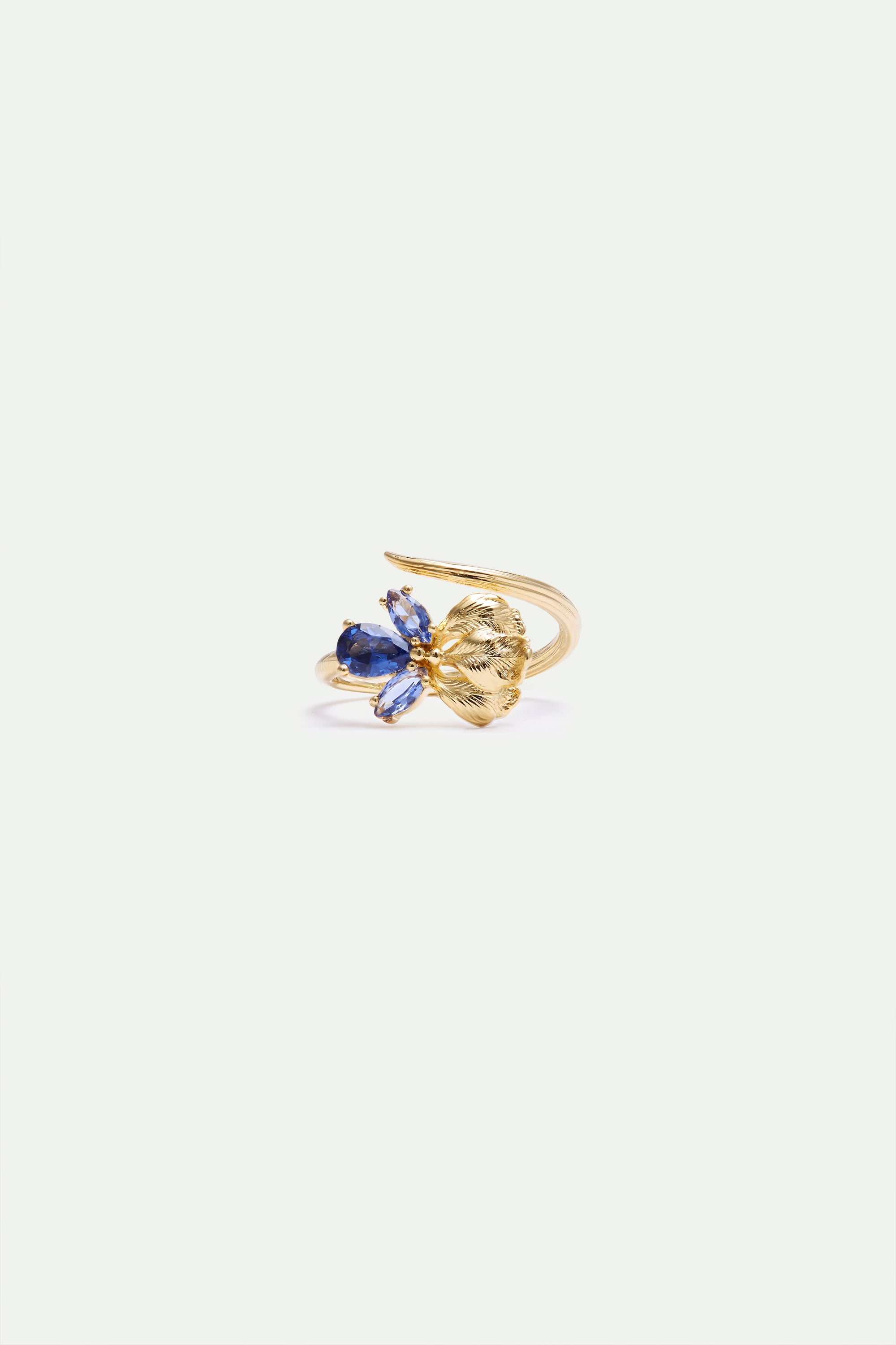 Adjustable gold-toned ring with a dark blue teardrop stone, three lighter blue marquise stones, and a textured gold-toned lea