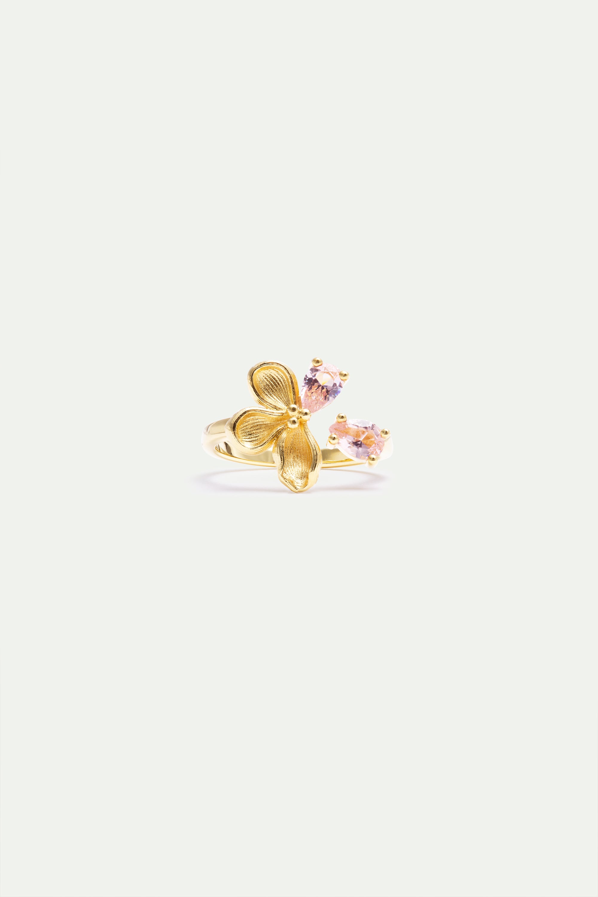 Gold-toned adjustable ring with a textured three-petal floral design and two light pink teardrop-shaped stones.