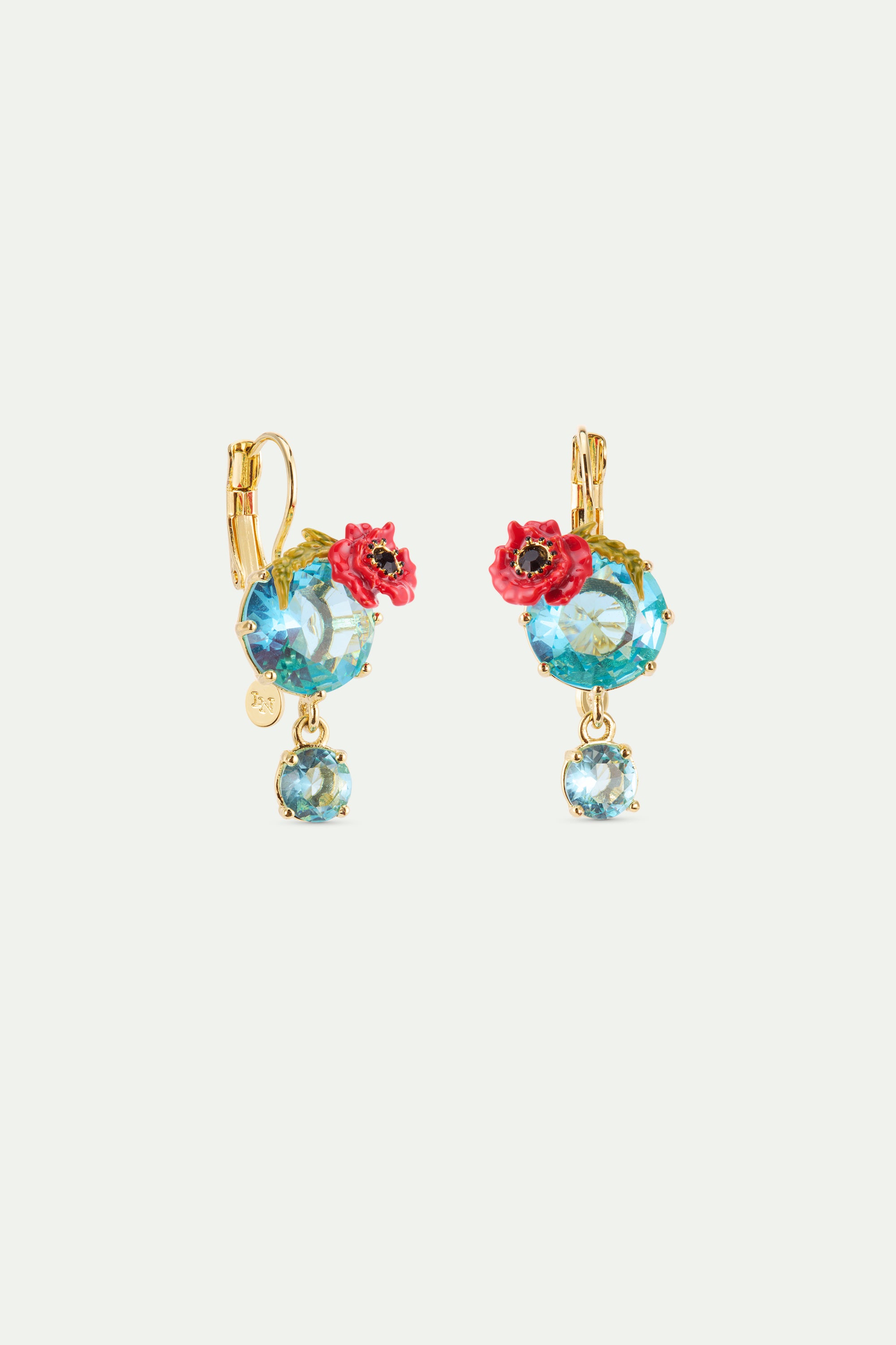 Gold-toned sleeper earrings: large blue crystals with red poppies & green leaves. Smaller blue crystals dangle. Left earring