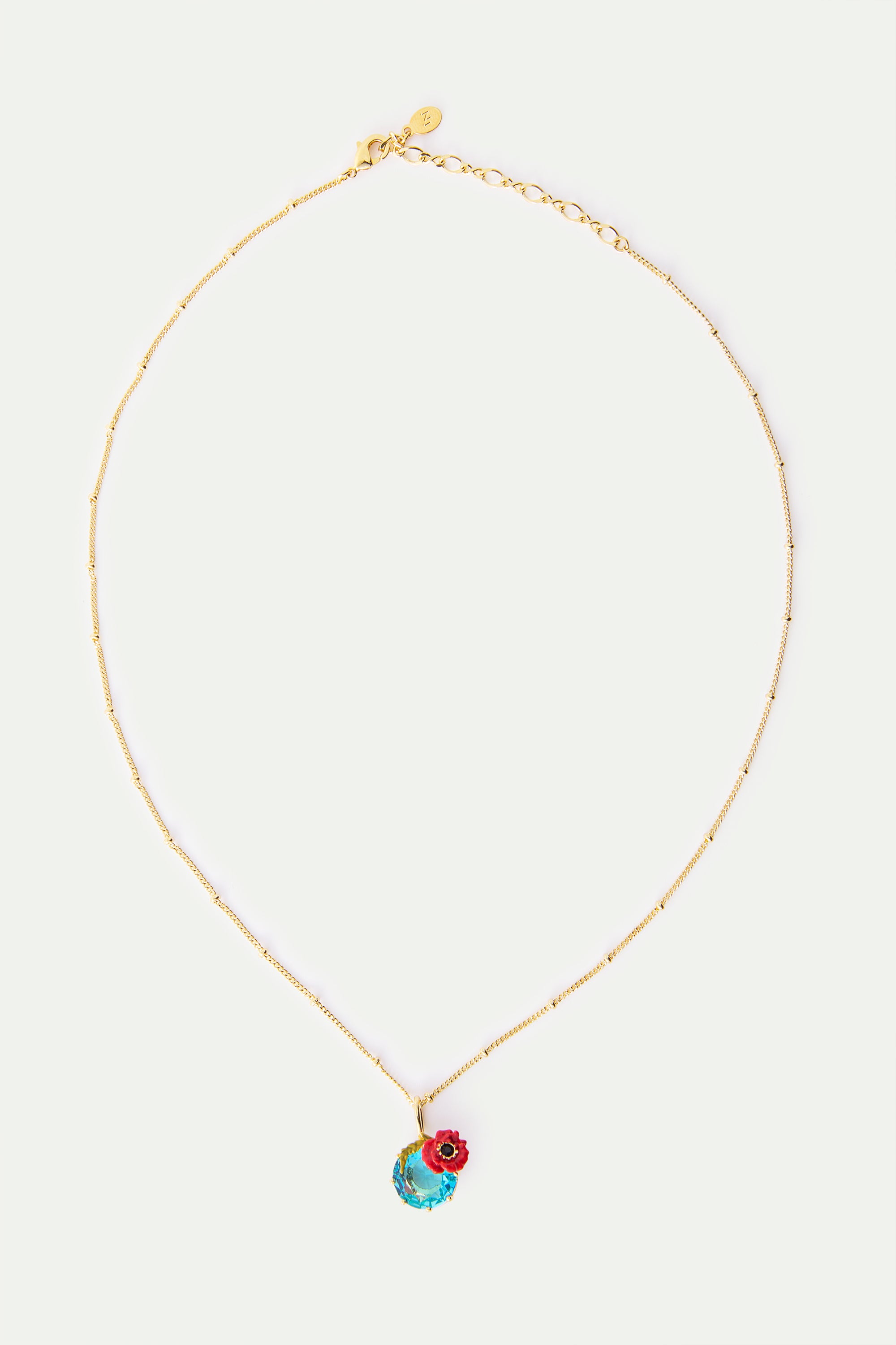 Gold-toned beaded chain necklace with a large faceted aqua gemstone pendant and a small red poppy flower detail.