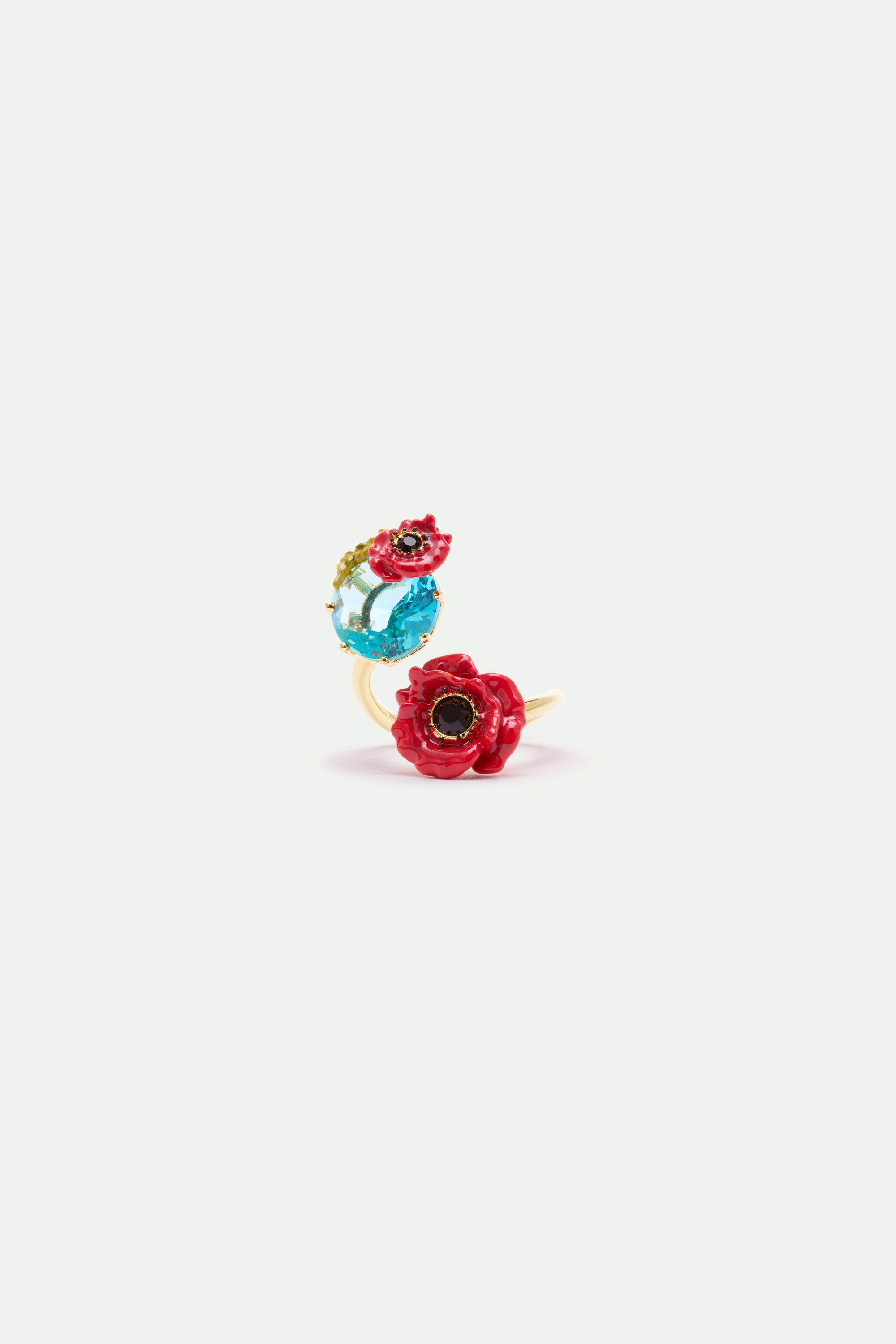 Gold-toned adjustable ring with a light blue faceted gemstone topped by a small red poppy, and a larger red poppy with a blac