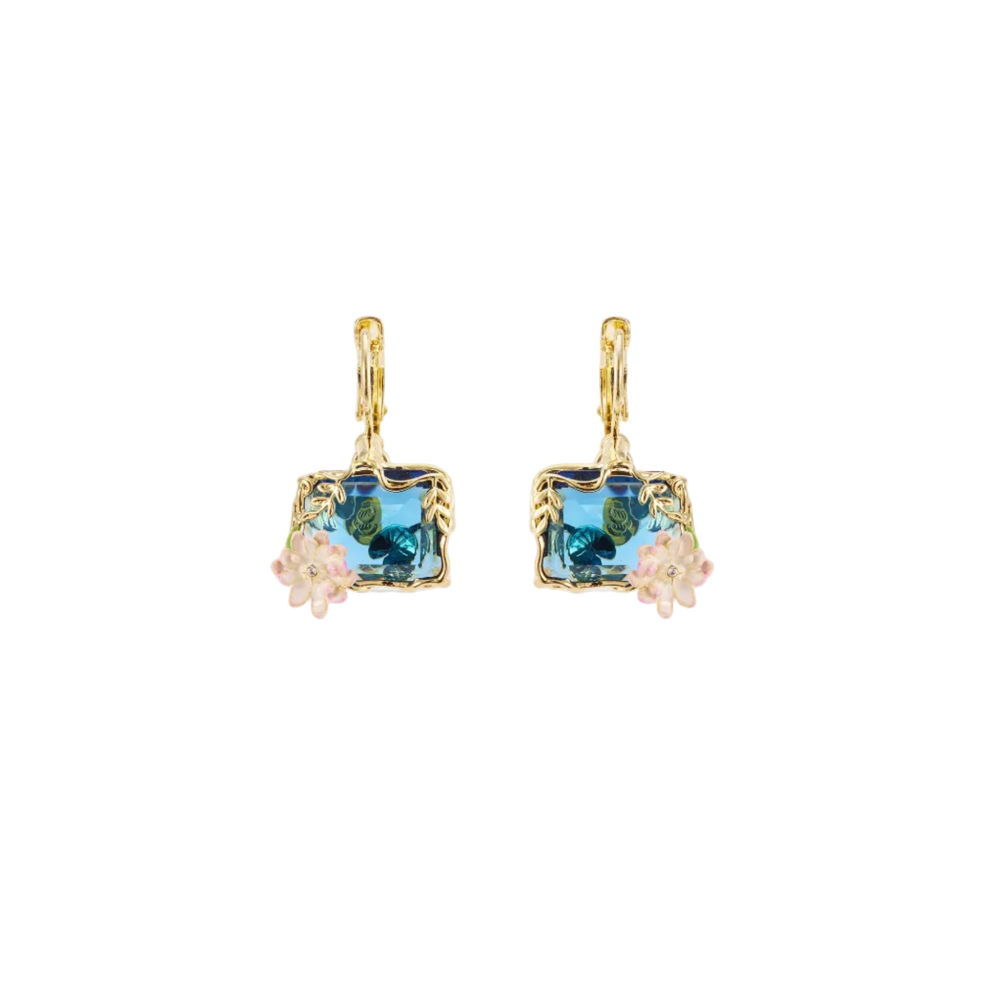 Pair of gold-toned sleeper earrings with rectangular blue faceted stones, framed by gold leaves, and light pink floral cluste