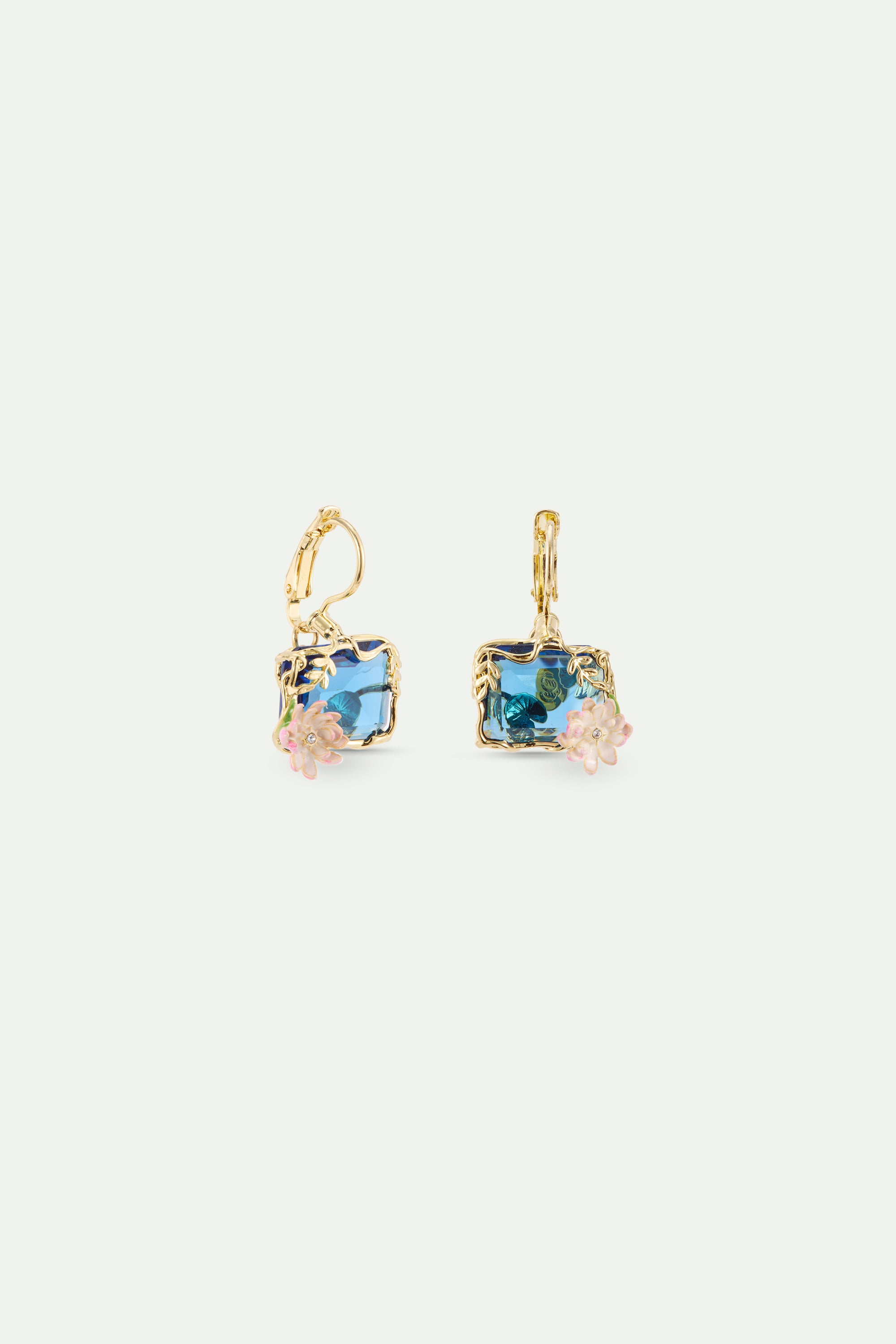 Gold-toned sleeper earring with a rectangular blue gem, framed by gold-toned leaves. The gem has darker blue details and thre