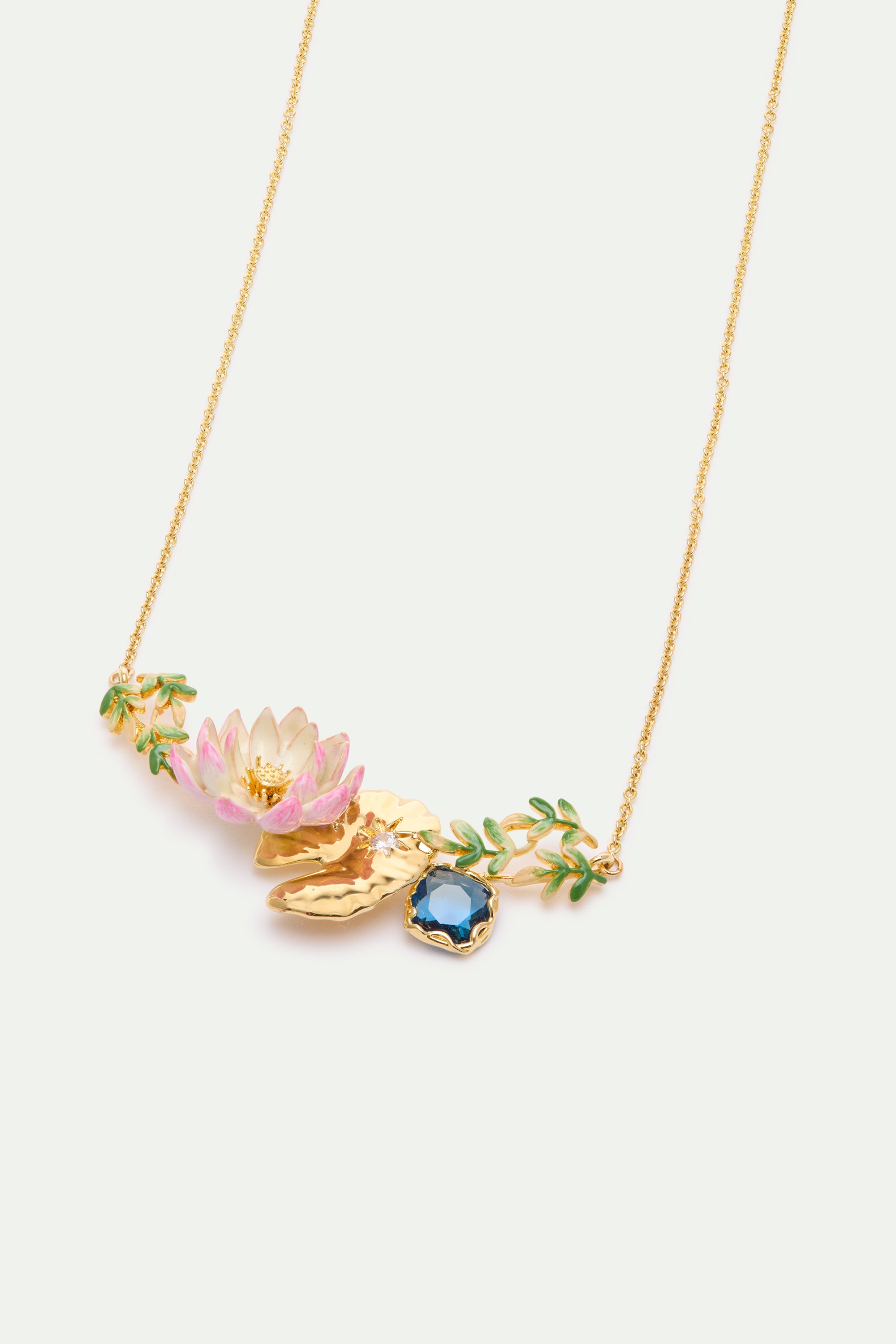 Gold-toned necklace with a central pendant featuring a pink and white lotus, gold-toned lily pads, green enamel leaves, and a