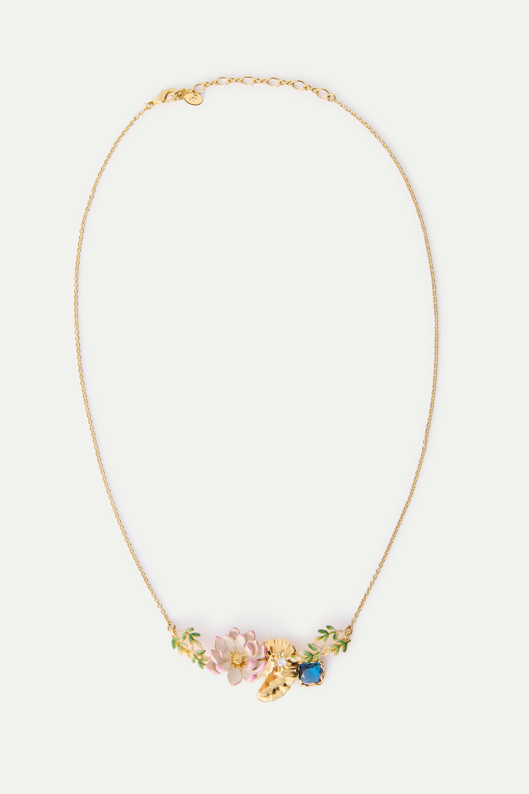 Gold-toned necklace with a pendant featuring pink flowers, green leaves, a textured gold-toned shape with a clear gem, and a