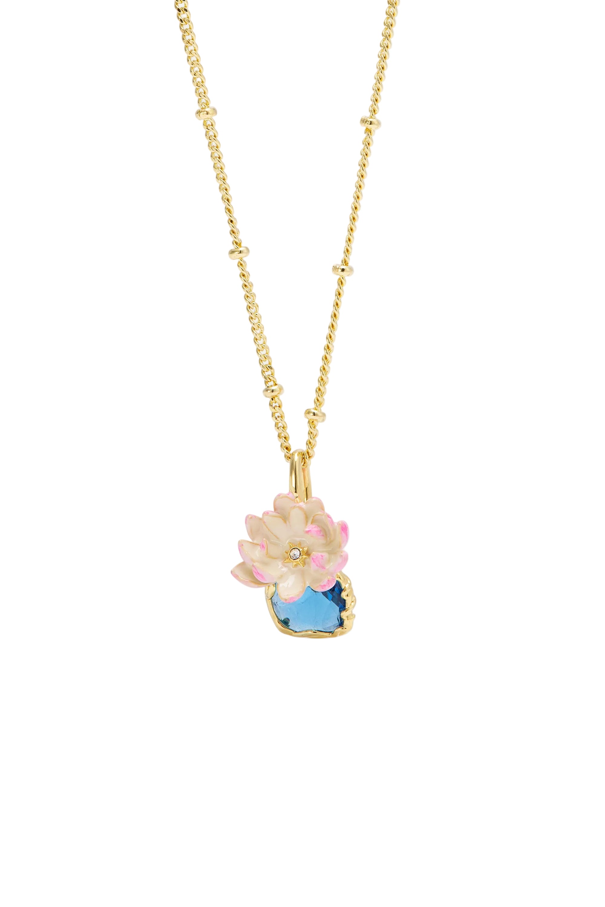 Gold-toned necklace with a pendant featuring a light pink and white enamelled flower with a clear stone, above a blue faceted