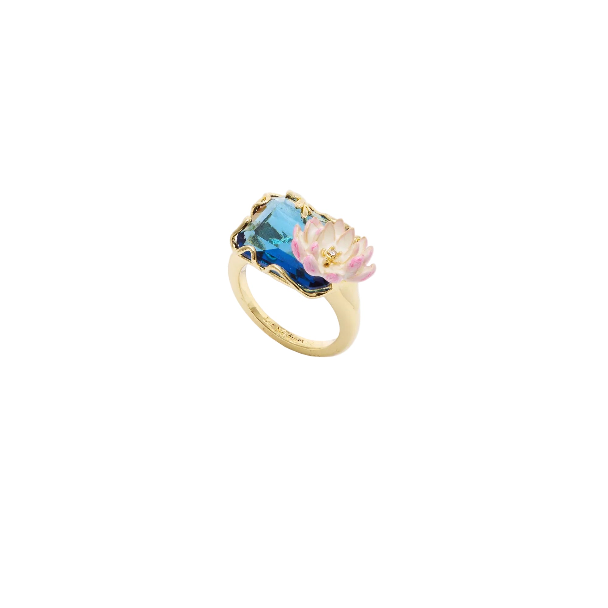 Gold-toned ring with a large blue faceted stone and a pink and white lotus flower with a clear central gem.