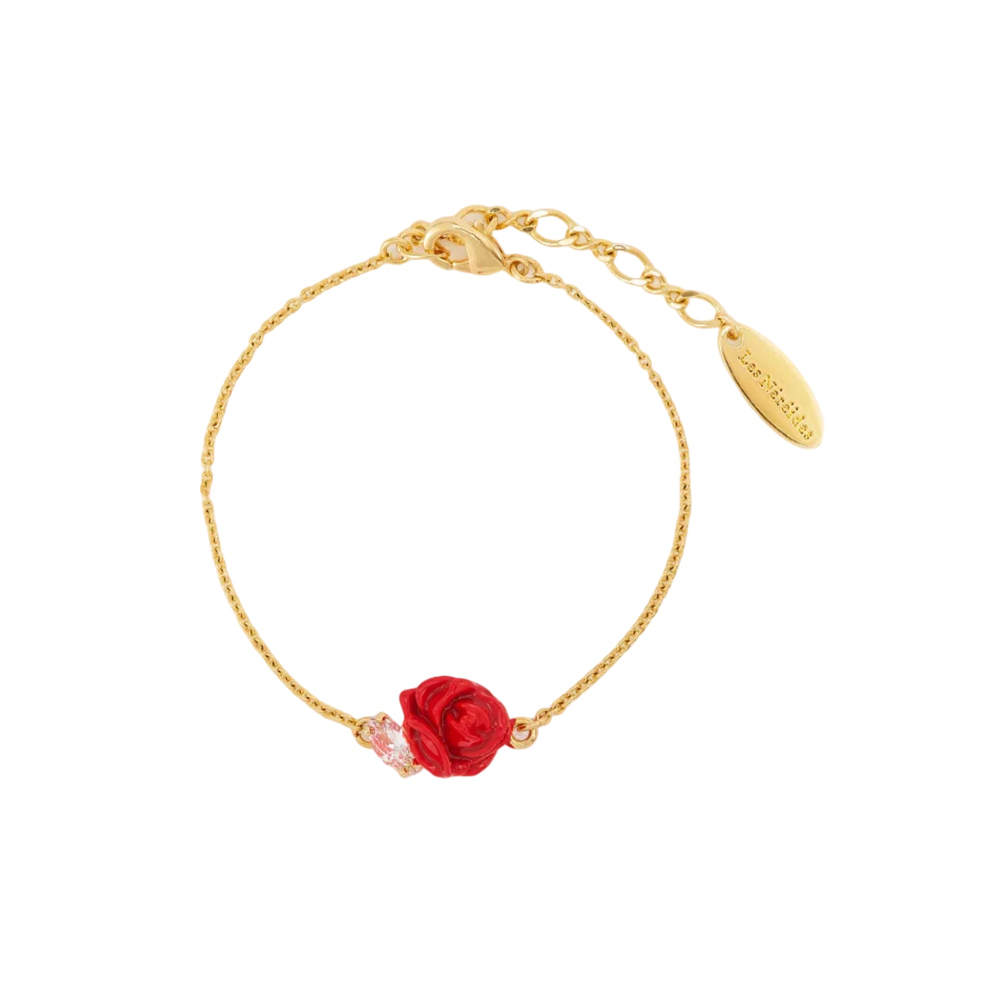 Gold-toned chain bracelet with a red enamel rose charm and a pink marquise-cut crystal. Features a lobster clasp.