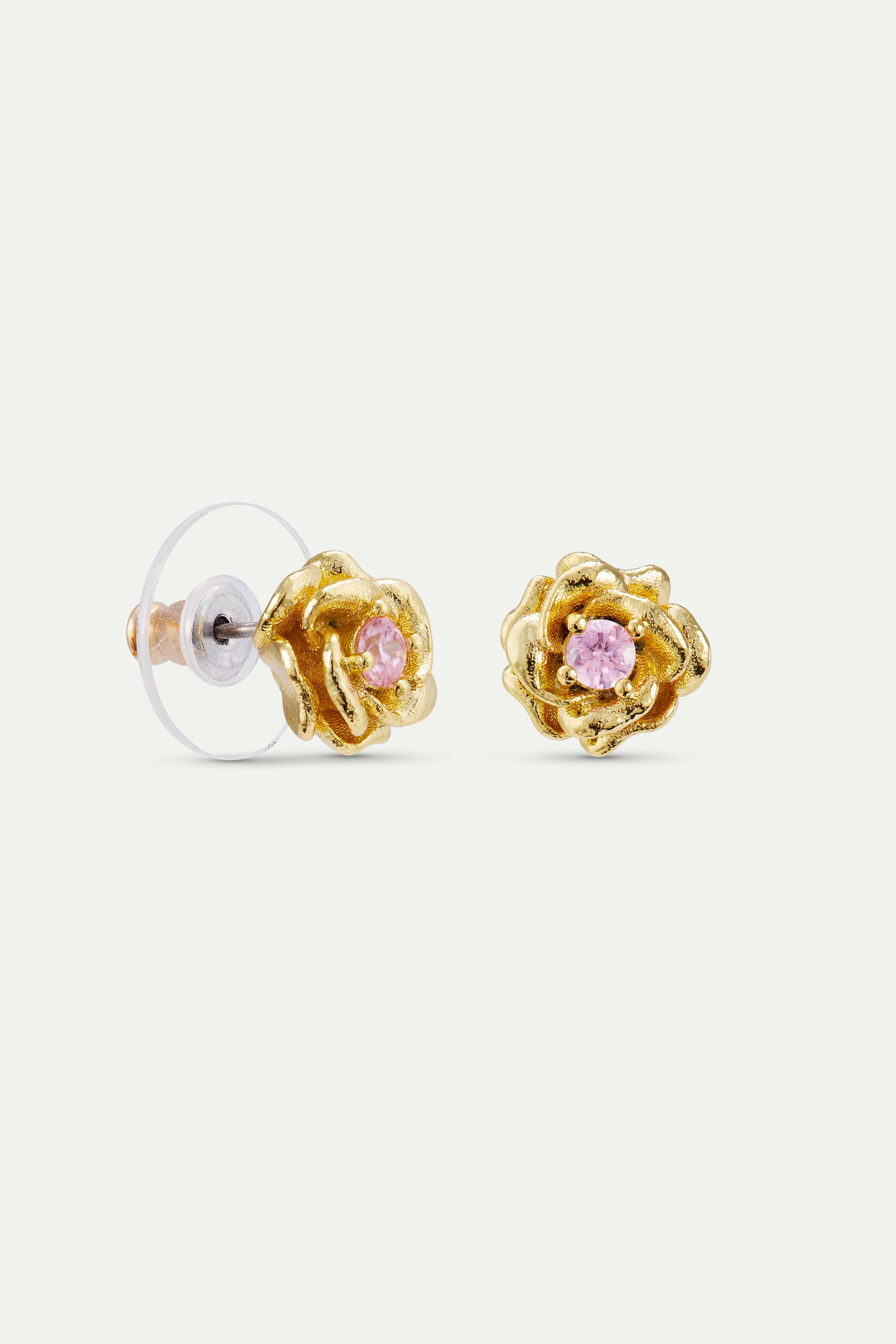 Pair of gold-toned rose stud earrings. Each has a pink stone center. Left earring shows clear post back.
