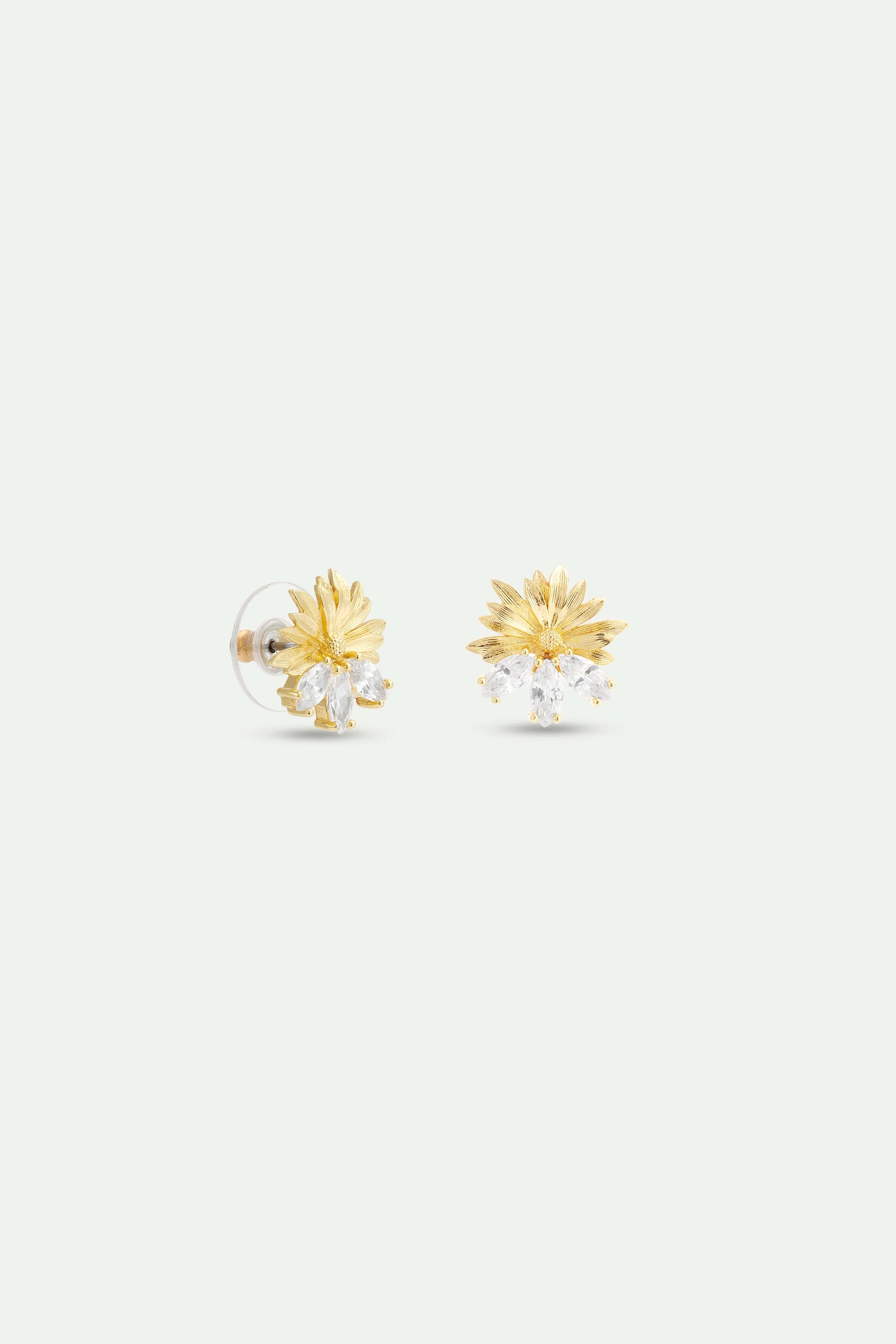 Pair of gold-toned post earrings with fanned textured leaves and three marquise-cut clear stones below.