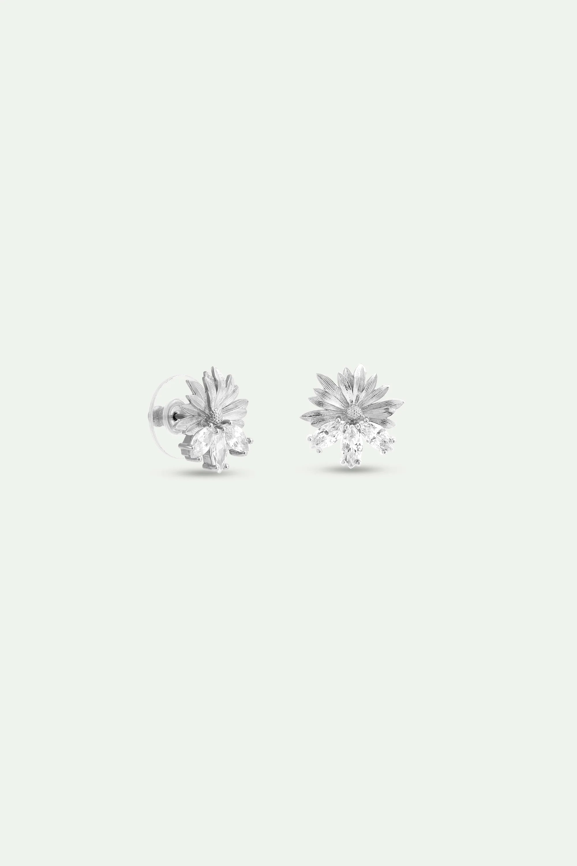 Pair of silver-toned post earrings with textured floral tops and clusters of clear marquise-cut stones.