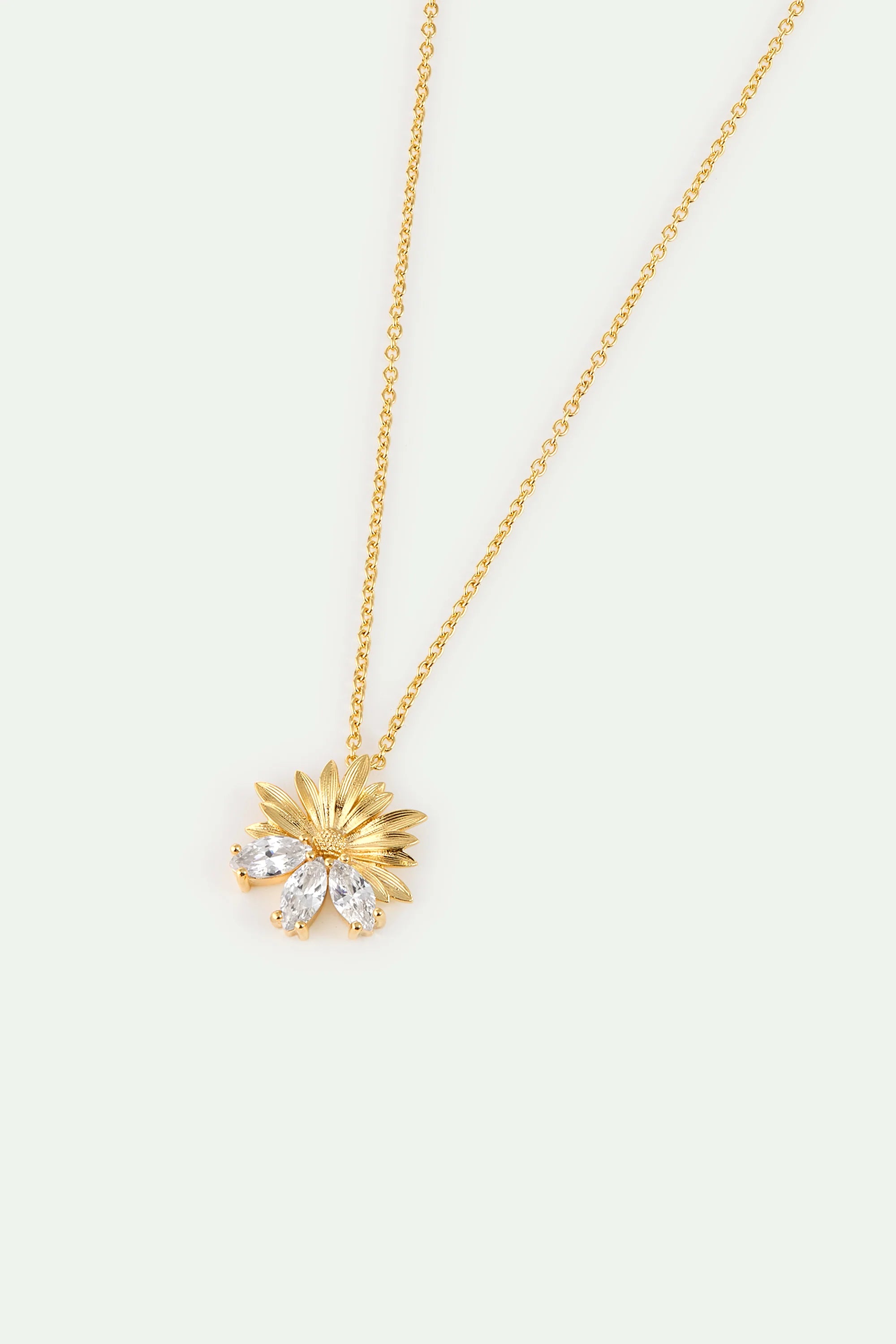 Gold-toned necklace with a textured flower pendant. The flower has gold-toned upper petals and three marquise-cut clear stone