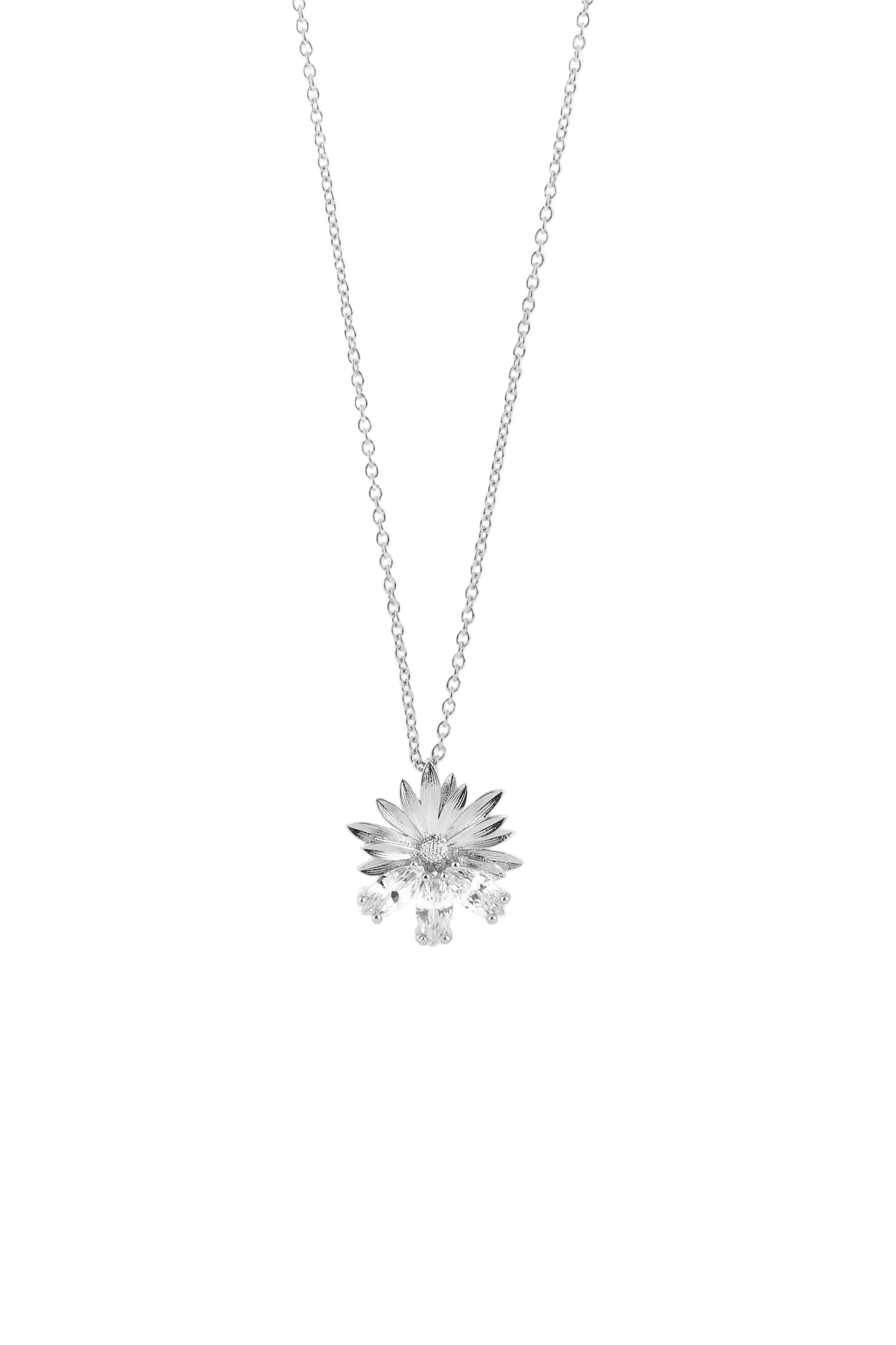 Silver-toned necklace with a detailed floral pendant and multiple clear, faceted stones dangling below.