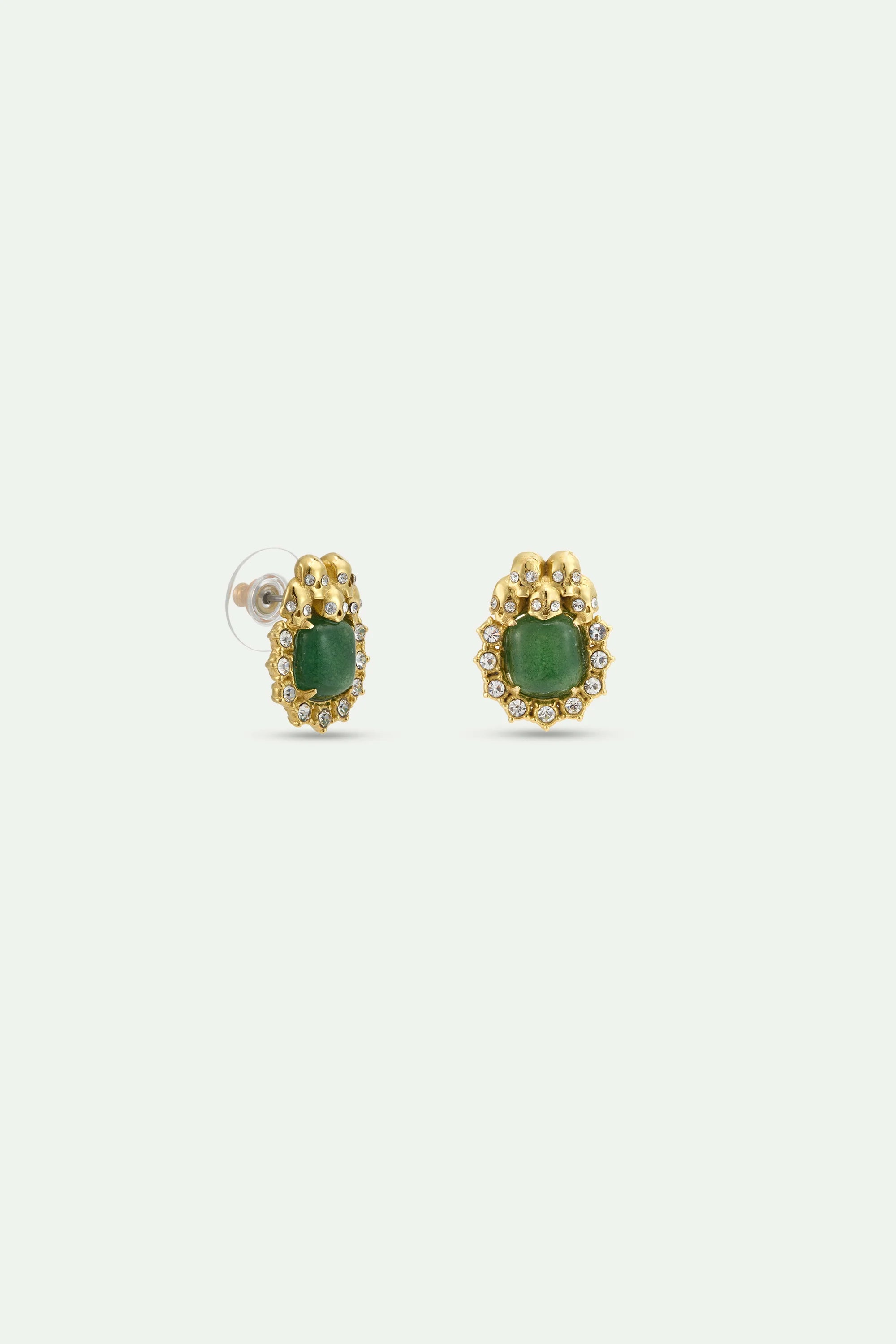 Pair of gold-toned post earrings, each with a cushion-cut green stone surrounded by clear crystals and small skull details.