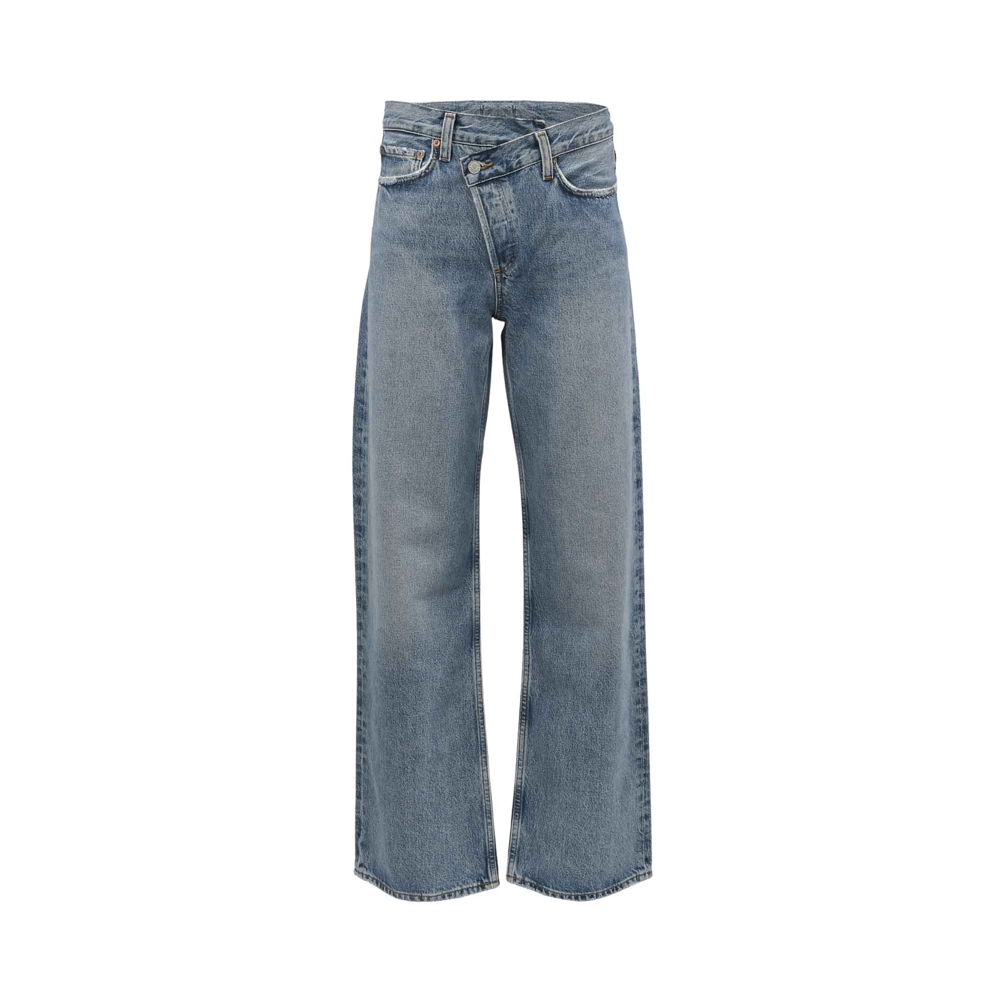 Front studio shot of Agolde wide-leg jeans in a medium wash blue, highlighting the signature asymmetrical criss-cross crossover waistband.
