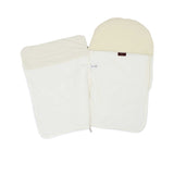 Interior view of the Aigner Kids baby nest unzipped, showing the soft white lining and the branded designer label.