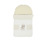 Front view of a beige Aigner Kids baby nest featuring a winter bear family print, beige geometric patterns, and a rounded hood.