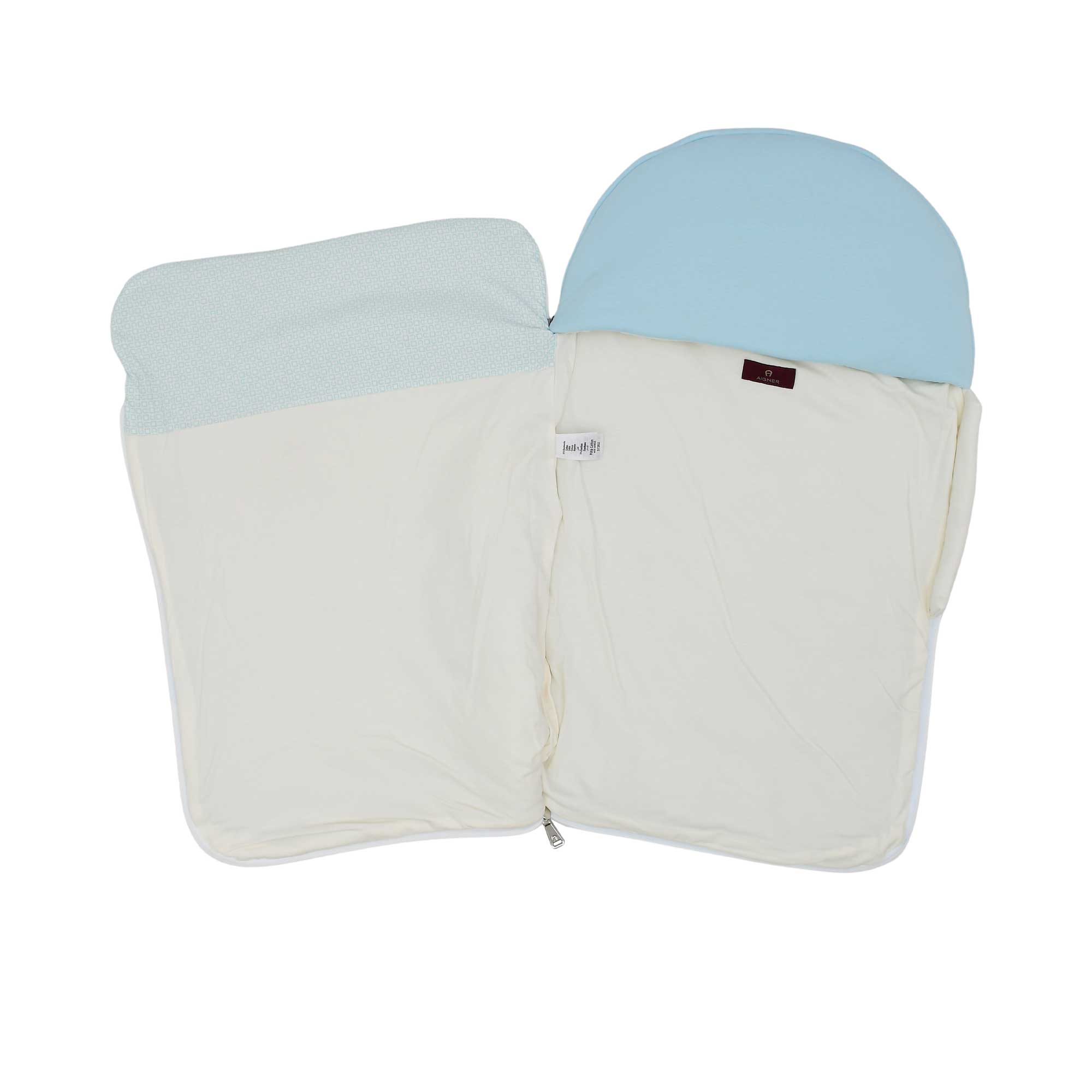 Interior view of the Aigner Kids baby nest unzipped, showing the soft white lining and the branded designer label.
