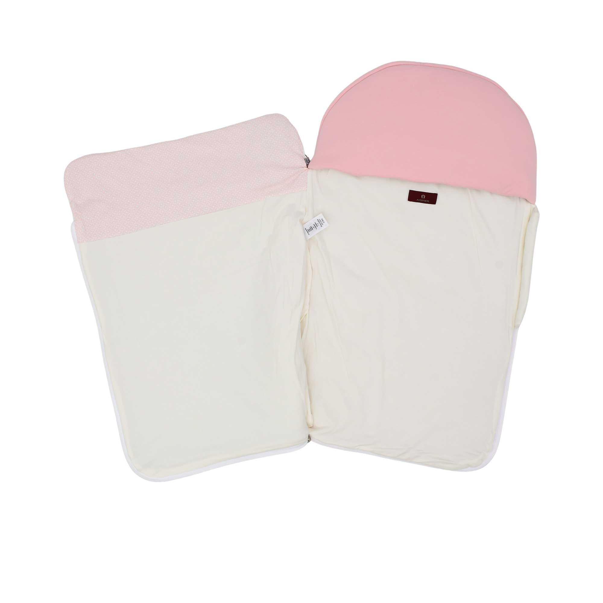 Interior view of the Aigner Kids baby nest unzipped, showing the soft white lining and the branded designer label.