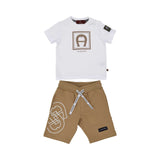 Full view of the Aigner Kids boys two-piece set featuring a white T-shirt with a tan logo box and tan jersey shorts with a large white graphic.