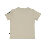 Rear view of a plain beige Aigner Kids cotton T-shirt showing the branded logo patch on the sleeve and a small logo tag at the side.